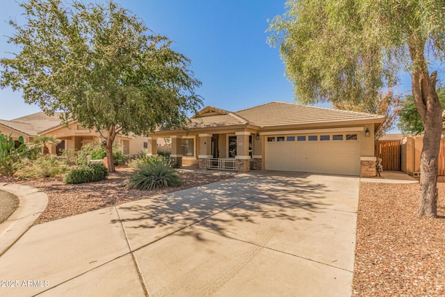 29900 N Maravilla Dr, San Tan Valley, AZ 85143 - view of front facade featuring driveway, an attached garage, stucco siding, stone siding, and a tiled roof