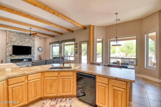 kitchen with hanging light fixtures, beam ceiling, a sink, black dishwasher, and visible vents