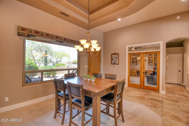 dining space with visible vents, an inviting chandelier, baseboards, recessed lighting, and arched walkways