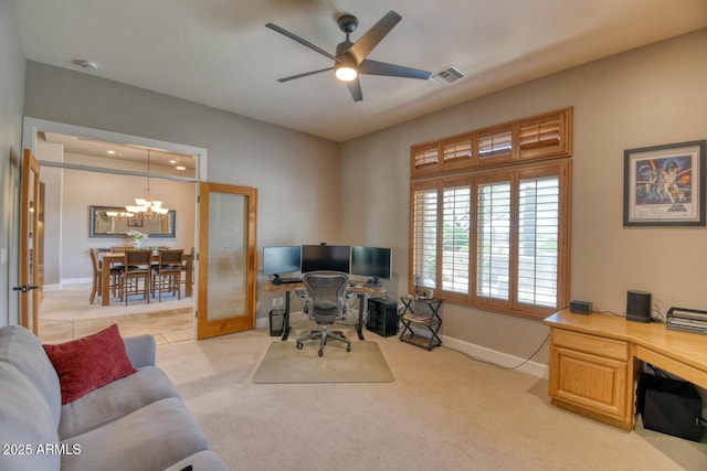 office with baseboards, light carpet, ceiling fan with notable chandelier, and visible vents