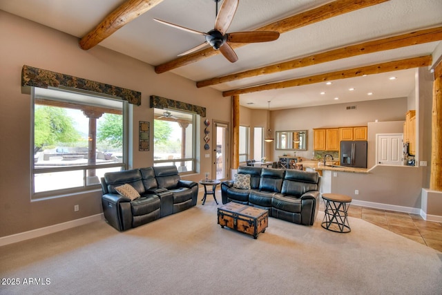 living area with ceiling fan, recessed lighting, baseboards, beamed ceiling, and visible vents