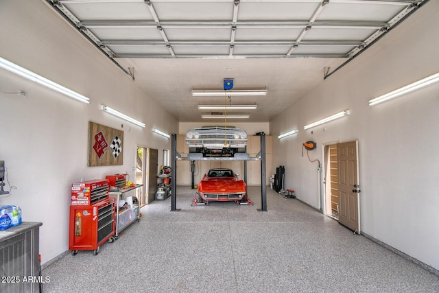 garage featuring baseboards