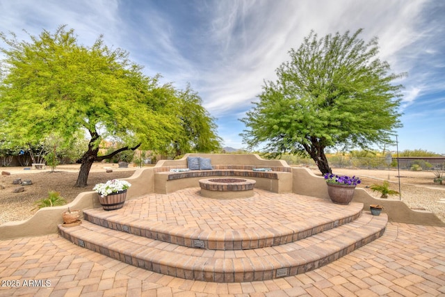 view of patio featuring an outdoor fire pit