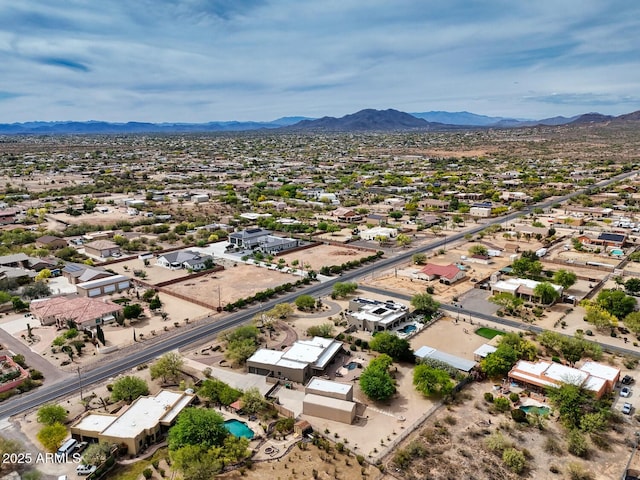 drone / aerial view featuring a residential view and a mountain view