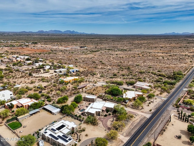 drone / aerial view with a rural view, a mountain view, and a desert view
