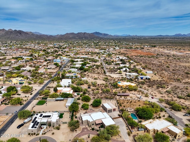 bird's eye view with a mountain view and view of desert