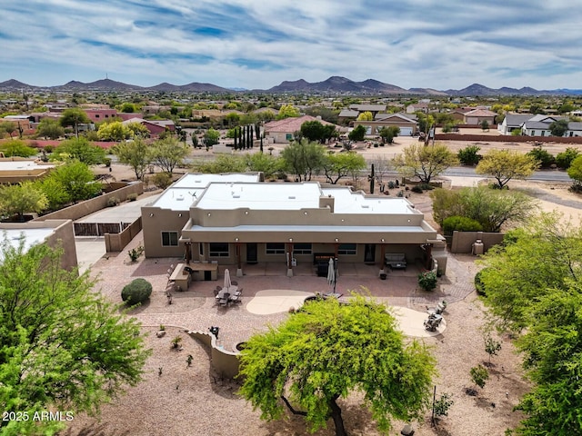 birds eye view of property featuring a mountain view