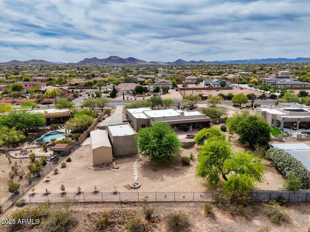birds eye view of property featuring a mountain view and a residential view