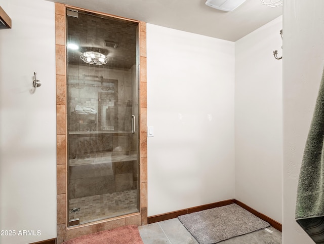 bathroom featuring an enclosed shower and tile patterned flooring