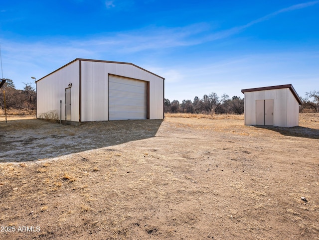 view of outdoor structure featuring a garage