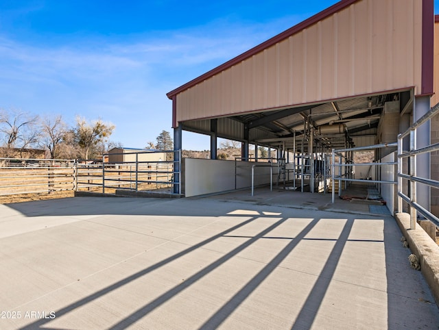 view of patio / terrace with an outbuilding