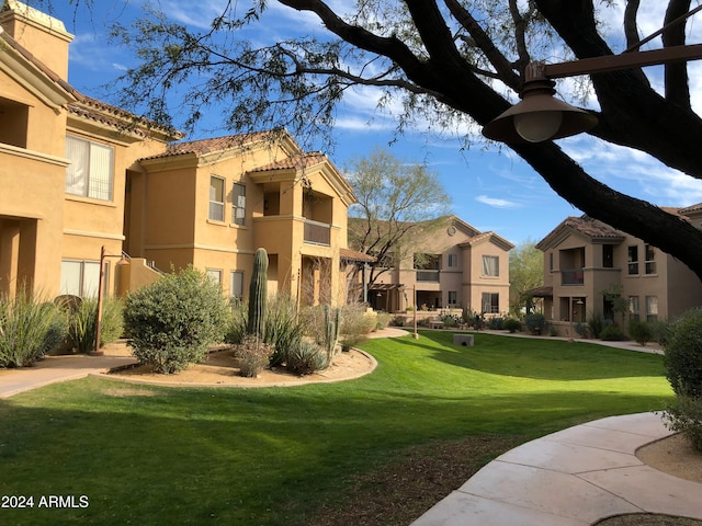 view of home's community with a lawn