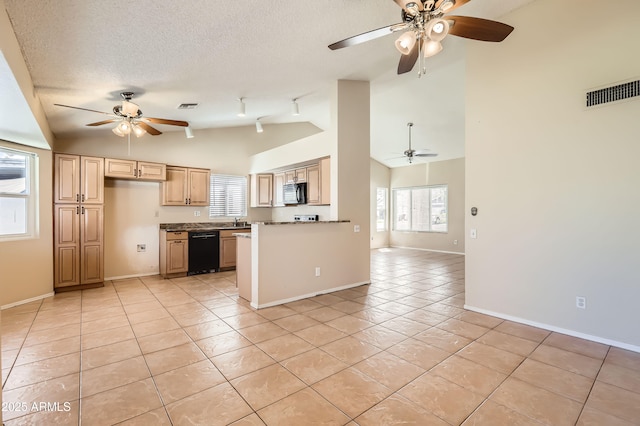 kitchen featuring light tile patterned floors, black appliances, a ceiling fan, visible vents, and baseboards