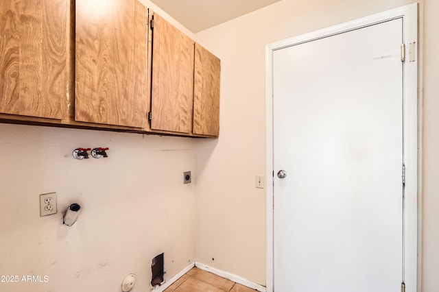 laundry area featuring washer hookup, light tile patterned floors, hookup for a gas dryer, electric dryer hookup, and cabinet space