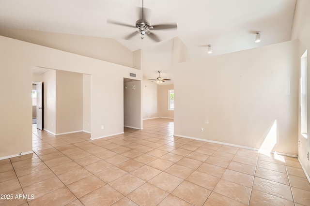 spare room with light tile patterned flooring, a ceiling fan, visible vents, and vaulted ceiling