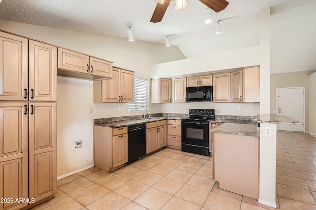 kitchen with light tile patterned floors, rail lighting, black appliances, a peninsula, and vaulted ceiling
