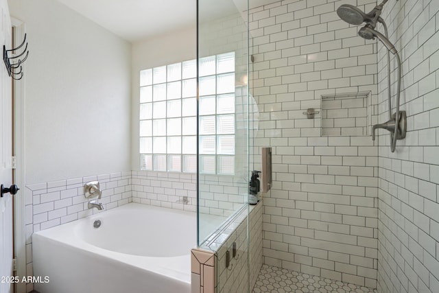 full bath with a bath and a stall shower