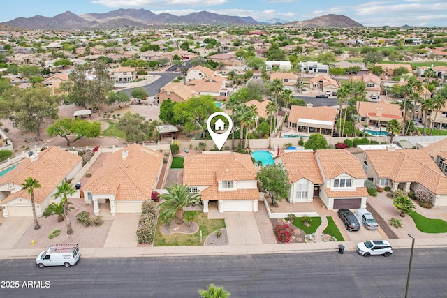 aerial perspective of suburban area with a mountainous background