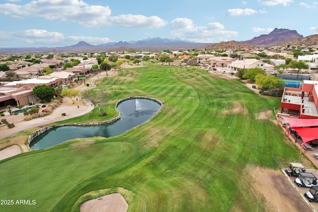 aerial perspective of suburban area with a water and mountain view and a golf club