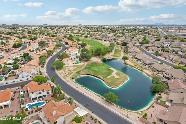aerial view of property and surrounding area featuring a water and mountain view, nearby suburban area, and a golf club