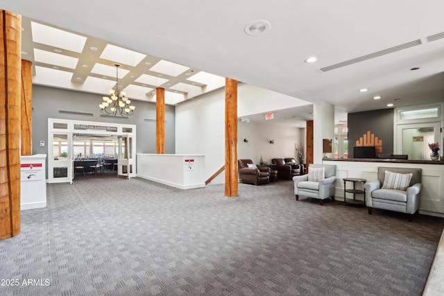 building lobby with recessed lighting, a high ceiling, coffered ceiling, and beamed ceiling