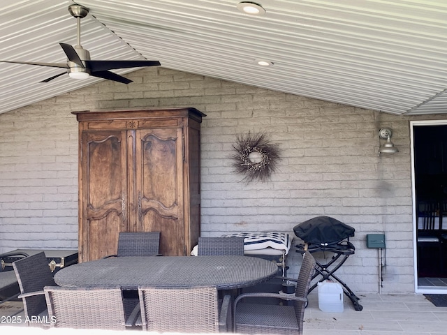 view of patio / terrace with outdoor dining area and a ceiling fan