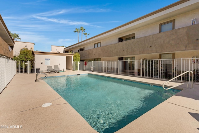 view of swimming pool with a patio area