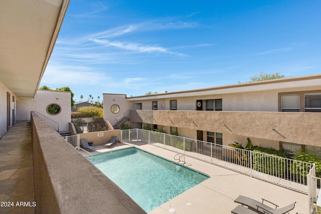 view of swimming pool featuring a patio