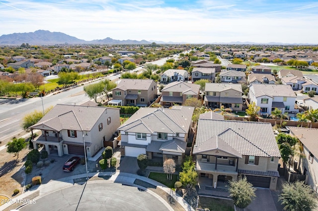 birds eye view of property with a mountain view