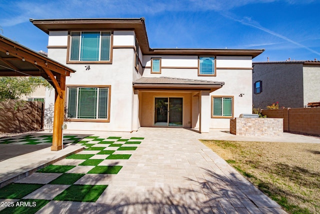 back of property featuring a patio area