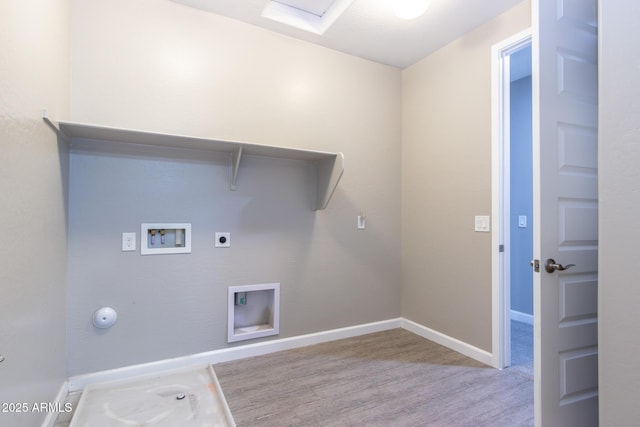 clothes washing area with hookup for a washing machine, electric dryer hookup, light hardwood / wood-style floors, and hookup for a gas dryer