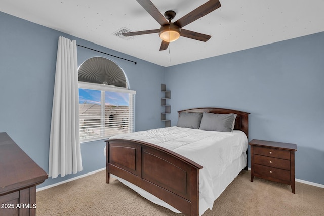 bedroom with ceiling fan, visible vents, baseboards, and light carpet