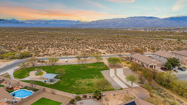 birds eye view of property with a mountain view