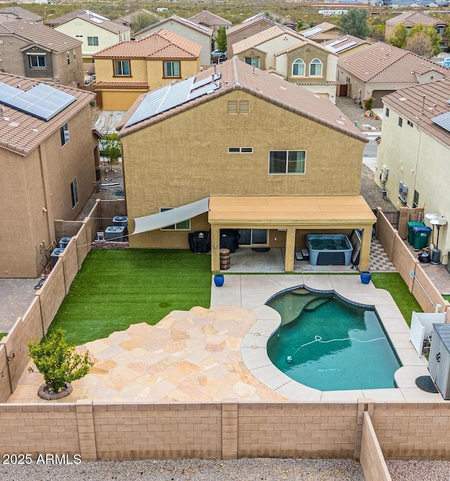 view of swimming pool with a residential view, a lawn, a patio, and a fenced backyard