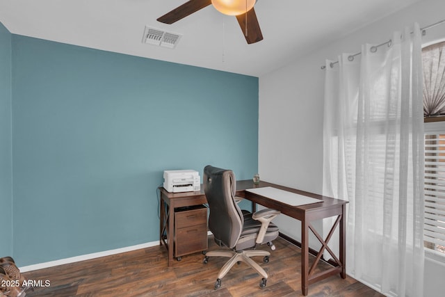 office featuring visible vents, baseboards, wood finished floors, and a ceiling fan