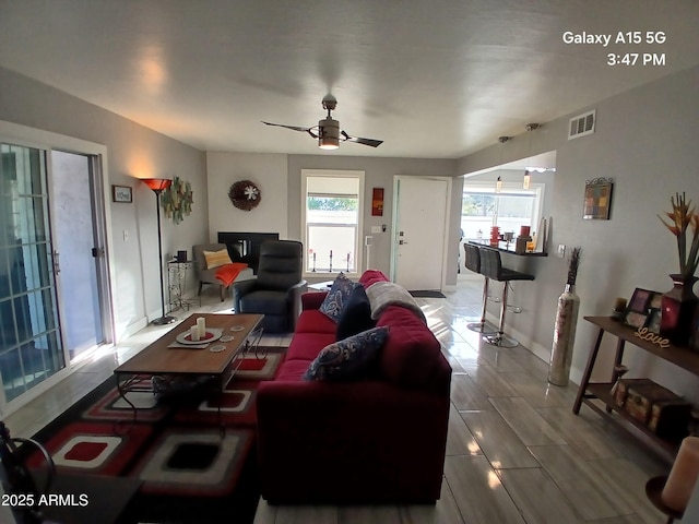 living room with ceiling fan