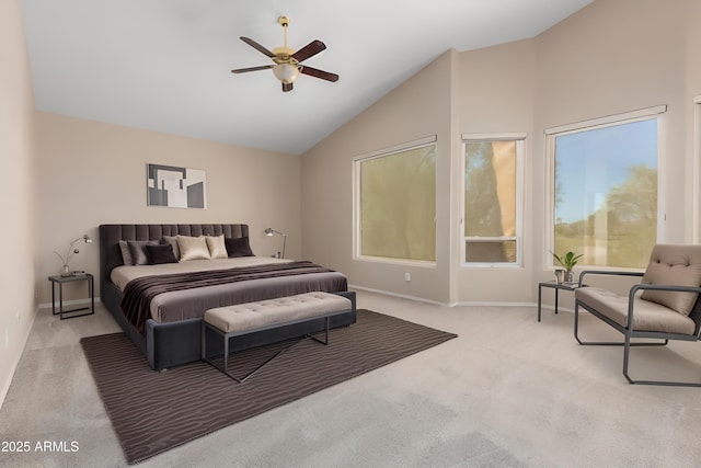 carpeted bedroom with high vaulted ceiling and ceiling fan