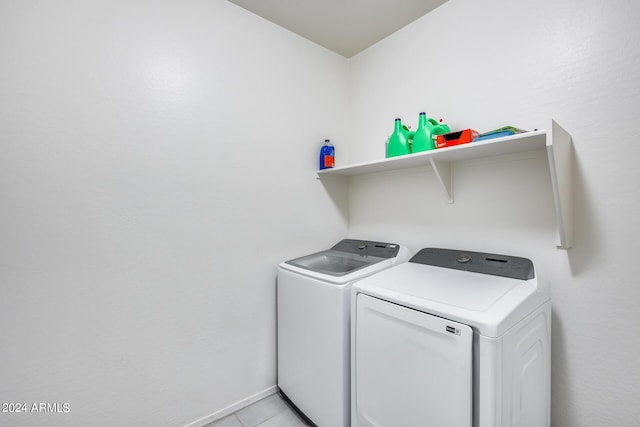 laundry room with washing machine and clothes dryer