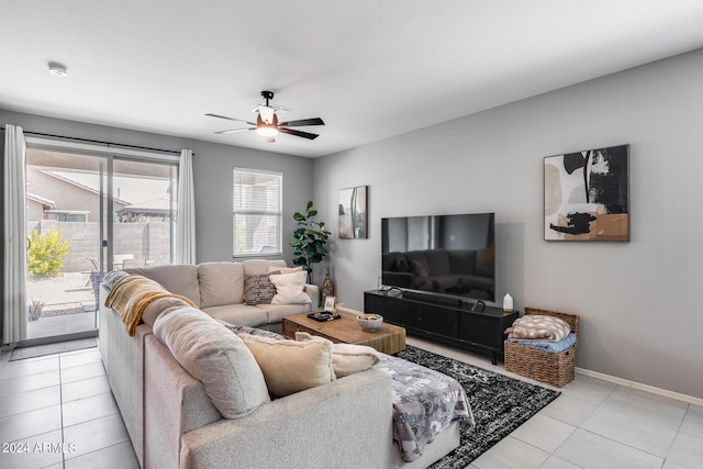 living room featuring light tile patterned floors and ceiling fan