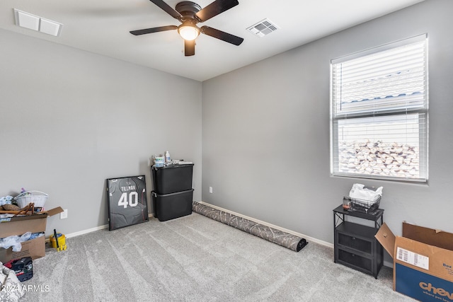 miscellaneous room with light colored carpet and ceiling fan