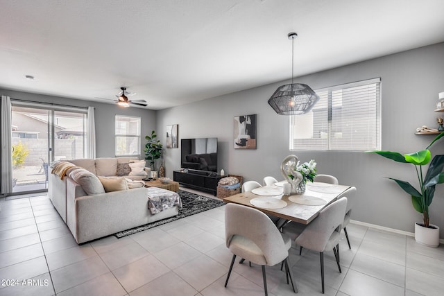 tiled dining room featuring ceiling fan