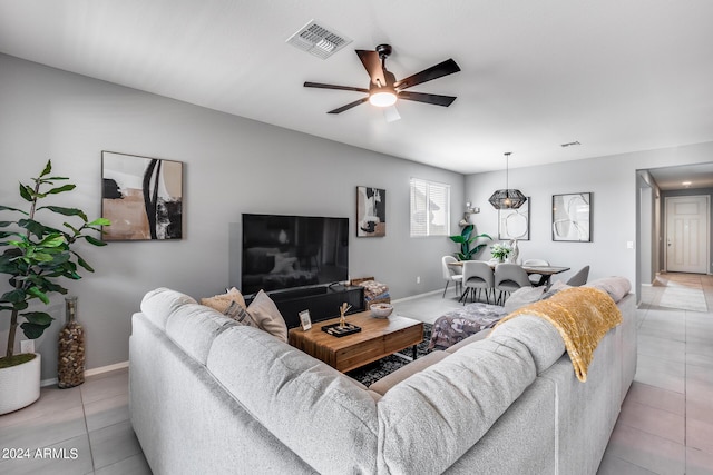 tiled living room featuring ceiling fan