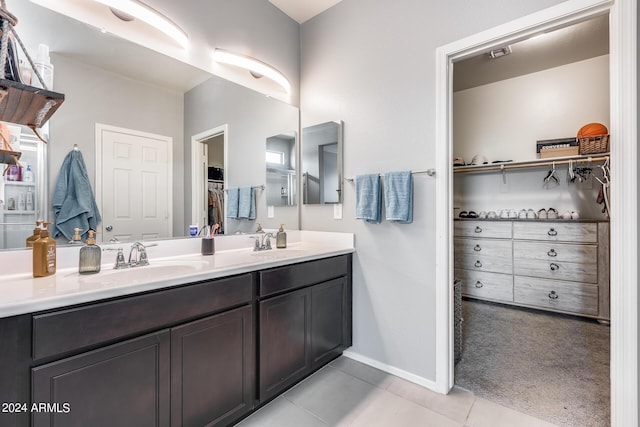 bathroom with vanity and tile patterned floors