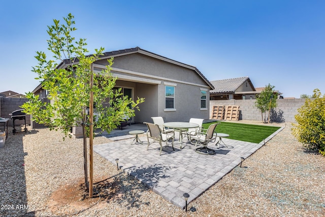 rear view of property with a patio