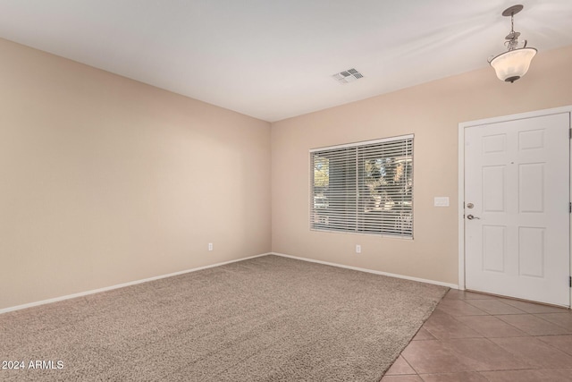 foyer entrance featuring light tile patterned flooring