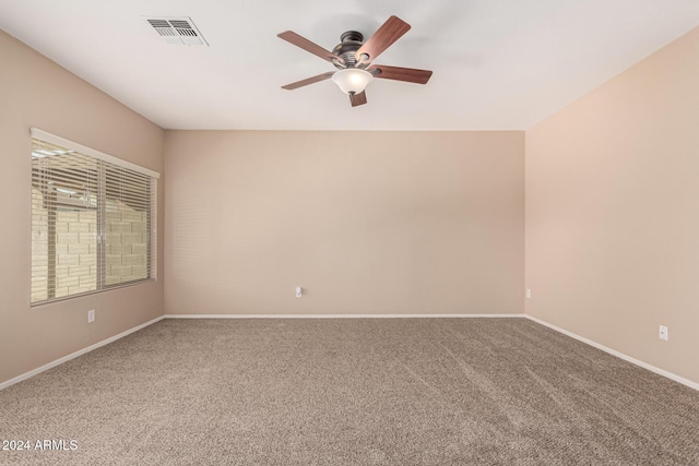 carpeted empty room with ceiling fan