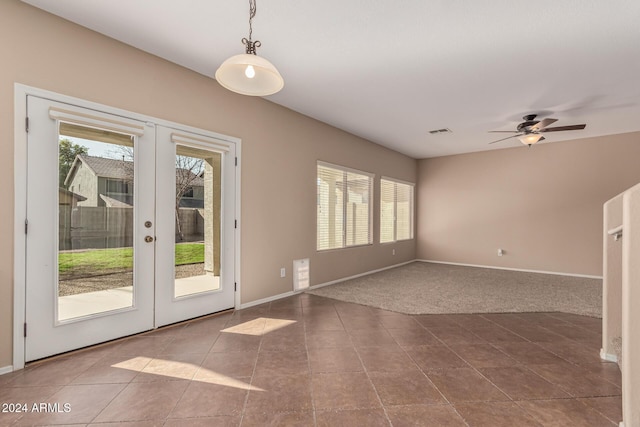 interior space with tile patterned flooring, ceiling fan, and french doors