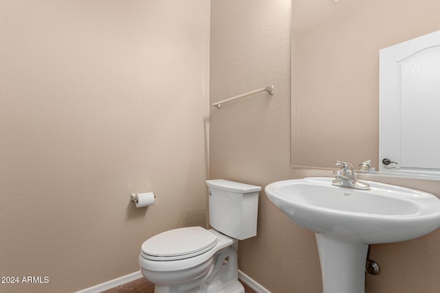 bathroom featuring toilet