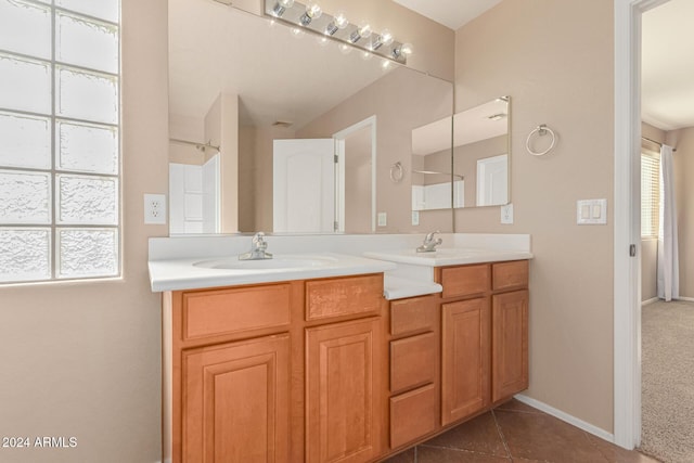 bathroom with tile patterned floors and vanity