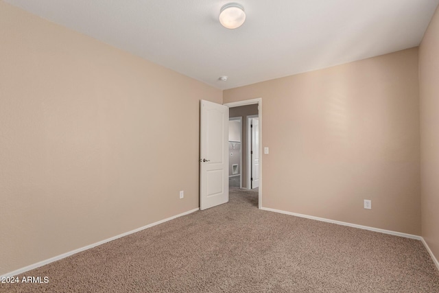 unfurnished room with carpet floors